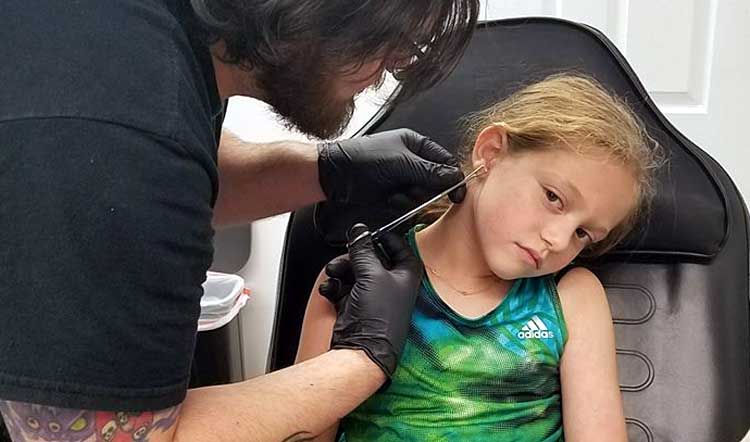 get-your-child-s-ears-pierced-at-a-tattoo-parlor-yes-you-should